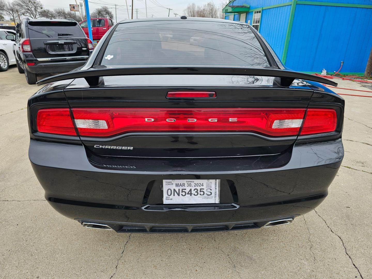 2014 Black Dodge Charger SE (2C3CDXBG6EH) with an 3.6L V6 DOHC 24V engine, 5-Speed Automatic transmission, located at 2020 East Division Street, Arlington, TX, 76011, (817) 801-3191, 32.742390, -97.076874 - Premiere Buy Here Pay Here with NO Credit Check (score) at 2020 East Division Street, Arlington, Texas, located in the center of the Dallas/Fort Worth metro area. For in-house financing in Lancaster, Waxahachie, Cleburne, Sherman, Denton, McKinney, Waco, Weatherford, Grand Prairie to Plano (along wi - Photo#2